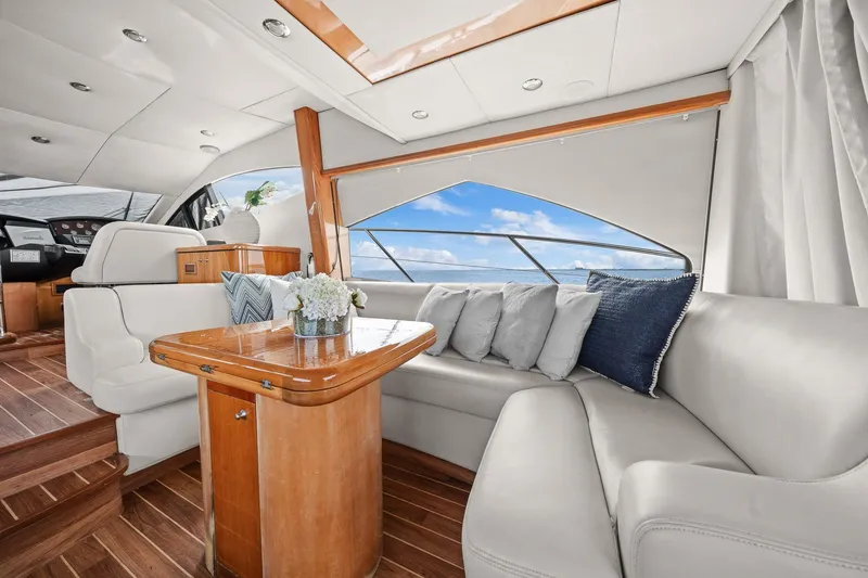 Slide: The Image of Luxurious interior of 2006 Sunseeker Manhattan 50 yacht with elegant seating and wooden accents. - 13