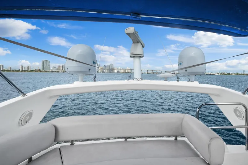 Slide: The Image of Sunseeker Manhattan 50 yacht, 2006 model, cruising with city skyline in background. - 20