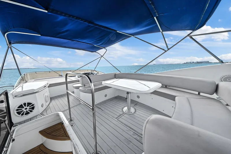 Slide: The Image of Luxurious 2006 Sunseeker Manhattan 50 yacht deck with seating and ocean view. - 23