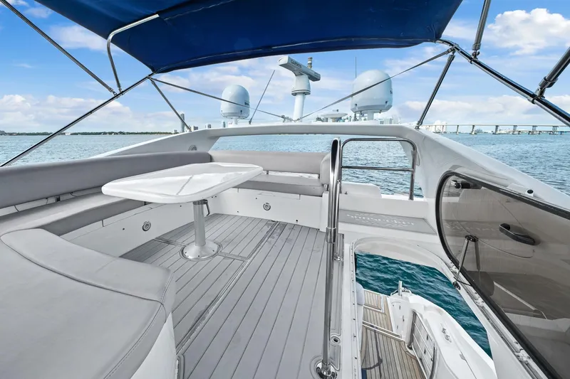 Slide: The Image of 2006 Sunseeker Manhattan 50 yacht deck with seating, table, and ocean view. - 24