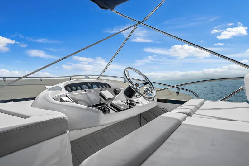 Slide: The Image of Helm of 2006 Sunseeker Manhattan 50 yacht with ocean view and blue sky. - 28