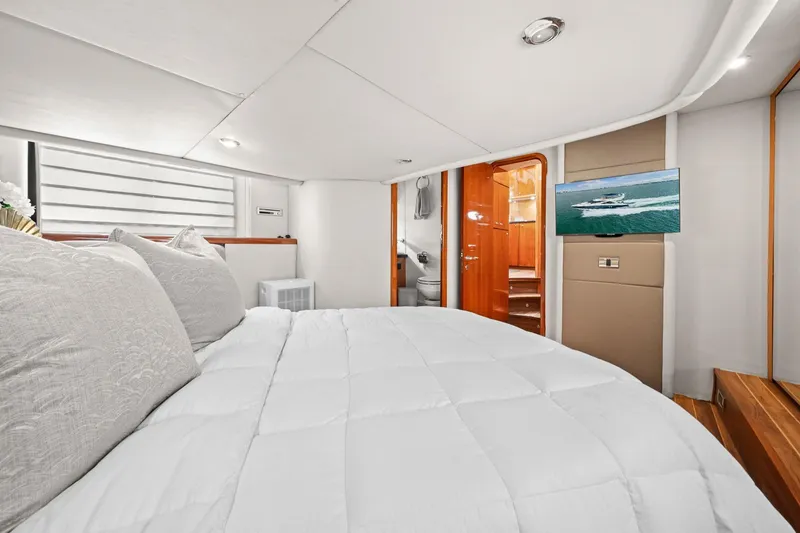 Slide: The Image of Luxurious bedroom interior of 2006 Sunseeker Manhattan 50 yacht with modern amenities. - 47