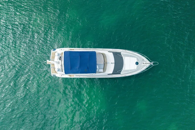 Slide: The Image of Aerial view of 2006 Sunseeker Manhattan 50 yacht on turquoise water. - 5