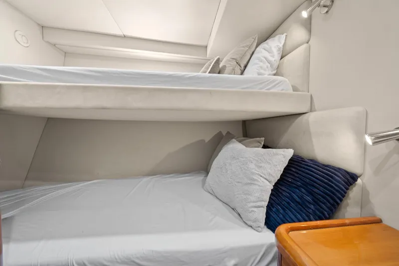 Slide: The Image of Bunk beds in 2006 Sunseeker Manhattan 50 yacht cabin, featuring cozy pillows and modern design. - 54