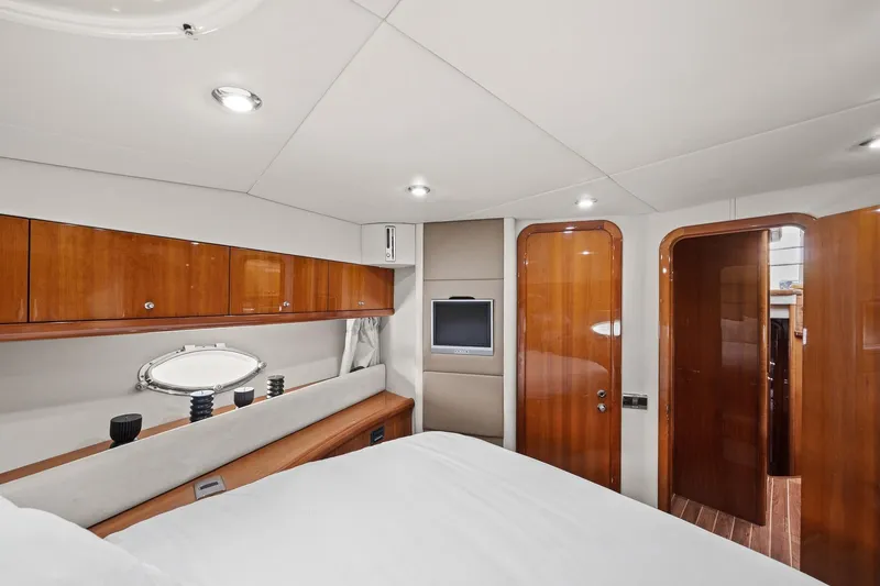 Slide: The Image of Luxurious cabin interior of 2006 Sunseeker Manhattan 50 yacht with wood finishes and modern amenities. - 57