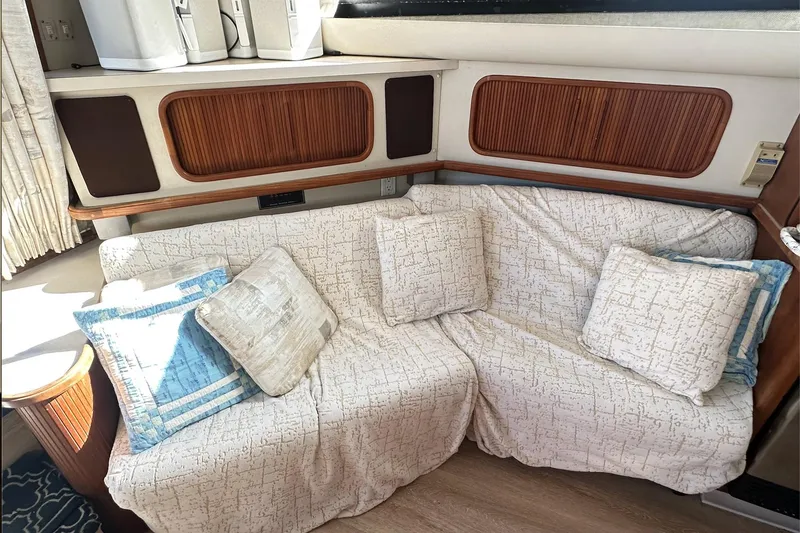 Slide: The Image of 1988 Carver 38 Santego interior with cozy sofa and decorative pillows. - 24