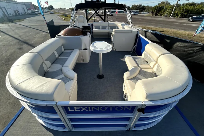 Slide: The Image of 2023 Lexington 321 CRUISE pontoon boat with spacious seating and modern design. - 11