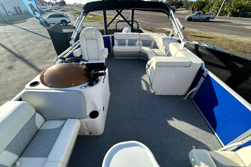 Slide: The Image of 2023 Lexington 321 CRUISE pontoon boat with spacious seating and modern design. - 12