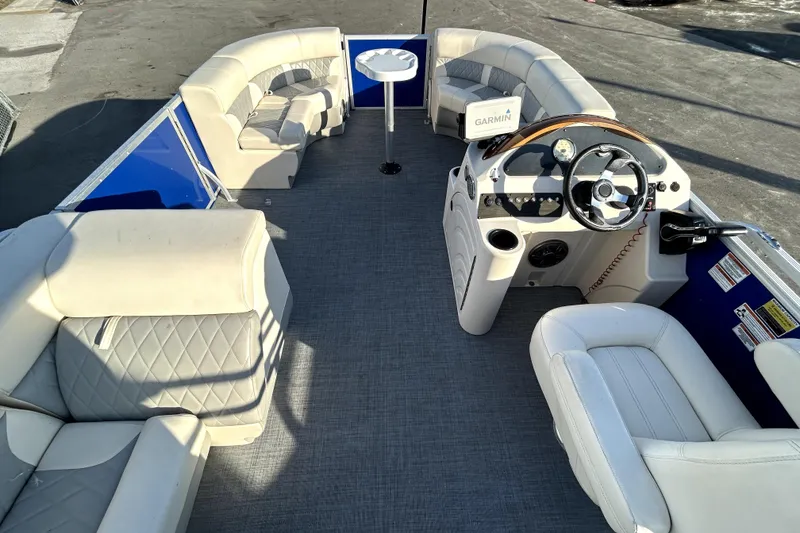 Slide: The Image of 2023 Lexington 321 CRUISE pontoon boat with seating, steering console, and sale sign. - 19
