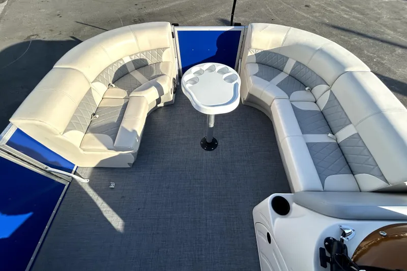 Slide: The Image of 2023 Lexington 321 CRUISE pontoon boat interior with seating and steering console. - 21
