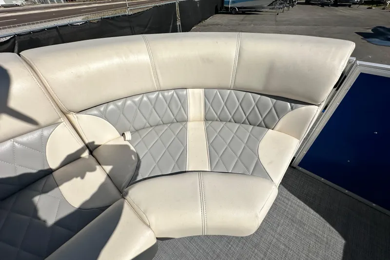 Slide: The Image of Luxurious seating on 2023 Lexington 321 CRUISE boat, featuring diamond-stitched upholstery. - 28