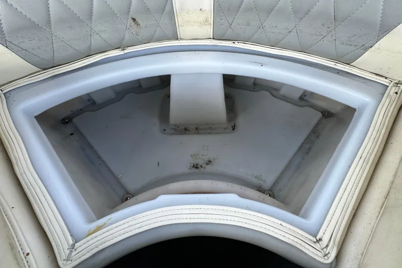 Slide: The Image of 2023 Lexington 321 CRUISE boat seat storage compartment, white upholstery, diamond pattern. - 33