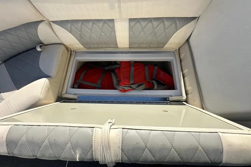 Slide: The Image of 2023 Lexington 321 CRUISE boat seat storage with life jackets inside. - 35
