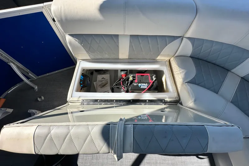 Slide: The Image of 2023 Lexington 321 CRUISE boat seat storage with battery and accessories. - 45
