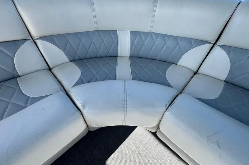 Slide: The Image of 2023 Lexington 321 CRUISE boat seating with quilted gray and white upholstery. - 47