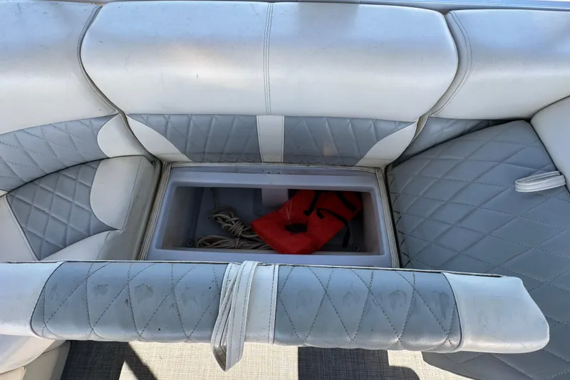 Slide: The Image of 2023 Lexington 321 CRUISE boat seat storage with life jacket and rope. - 51