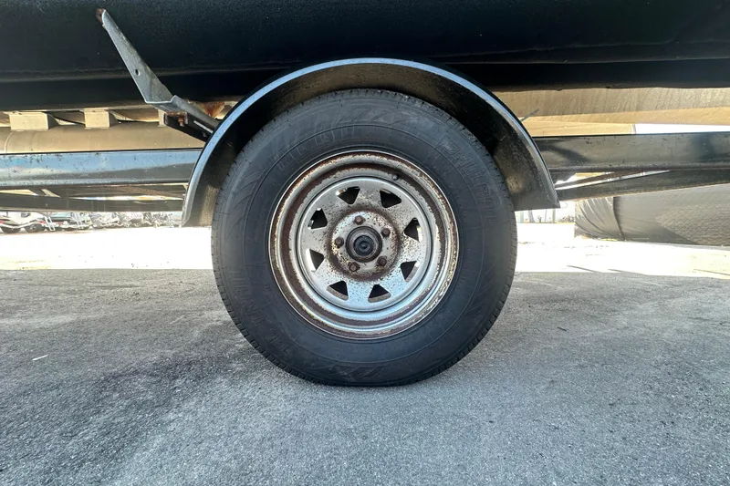 Slide: The Image of 2023 Lexington 321 CRUISE trailer wheel on concrete surface. - 60