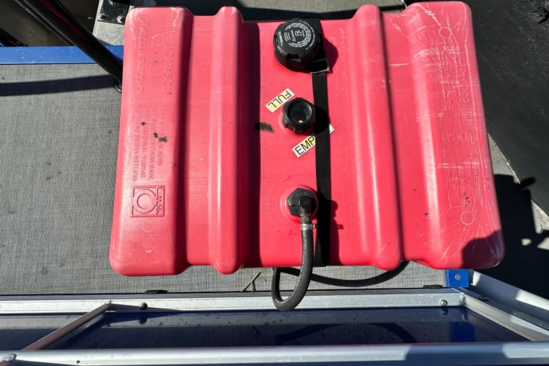 Slide: The Image of Red fuel tank on a 2023 Lexington 321 CRUISE boat deck. - 61