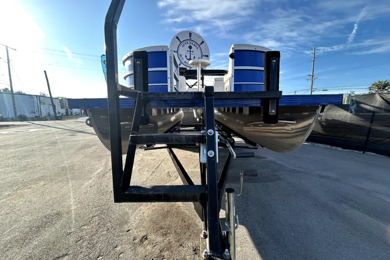 Slide: The Image of 2023 Lexington 321 CRUISE pontoon boat with blue exterior and canopy. - 7