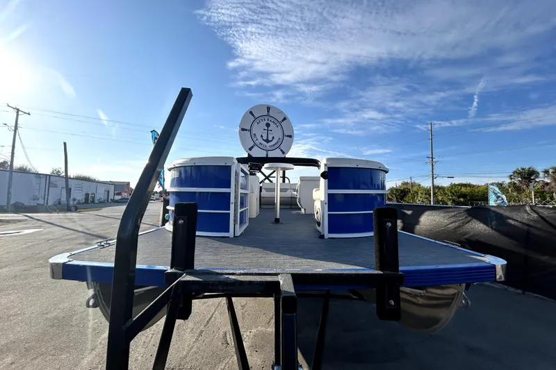 Slide: The Image of 2023 Lexington 321 CRUISE pontoon boat with blue exterior on a trailer. - 8