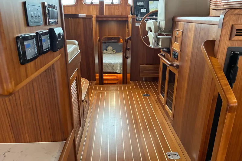 Slide: The Image of 2024 Helmsman Trawlers 43E PILOTHOUSE interior looking forward to pilothouse. - 17