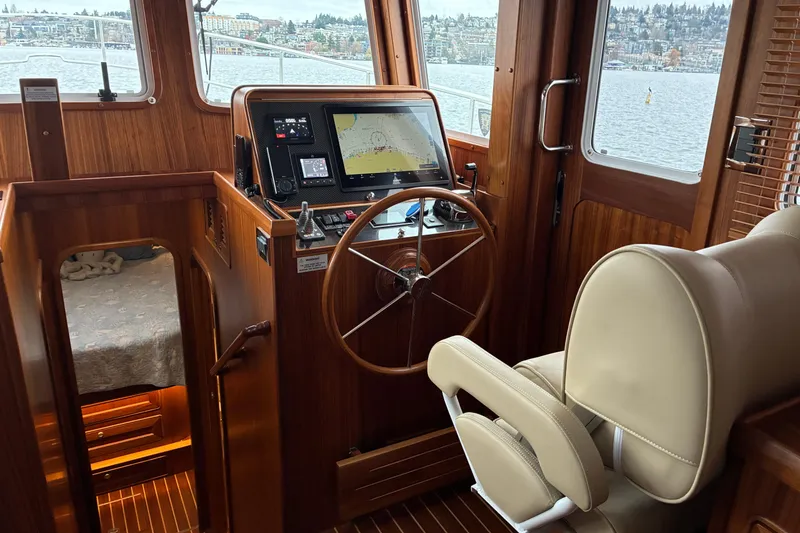 Slide: The Image of 2024 Helmsman Trawlers 43E Pilothouse helm station and view - 20