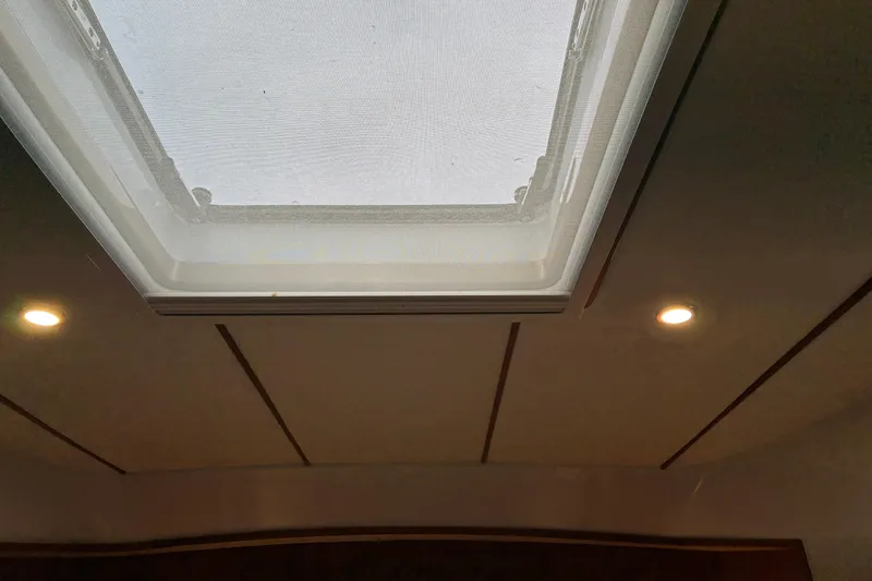 Slide: The Image of Skylight and ceiling lights in 2024 Helmsman Trawlers 43E Pilothouse owner's cabin. - 24