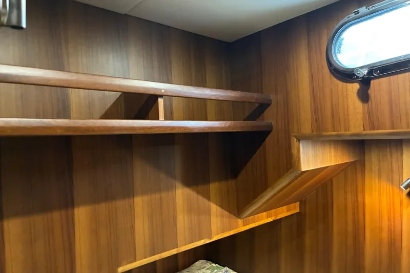 Slide: The Image of 2024 Helmsman Trawlers 43E PILOTHOUSE Guest cabin shelf and port hole - 25