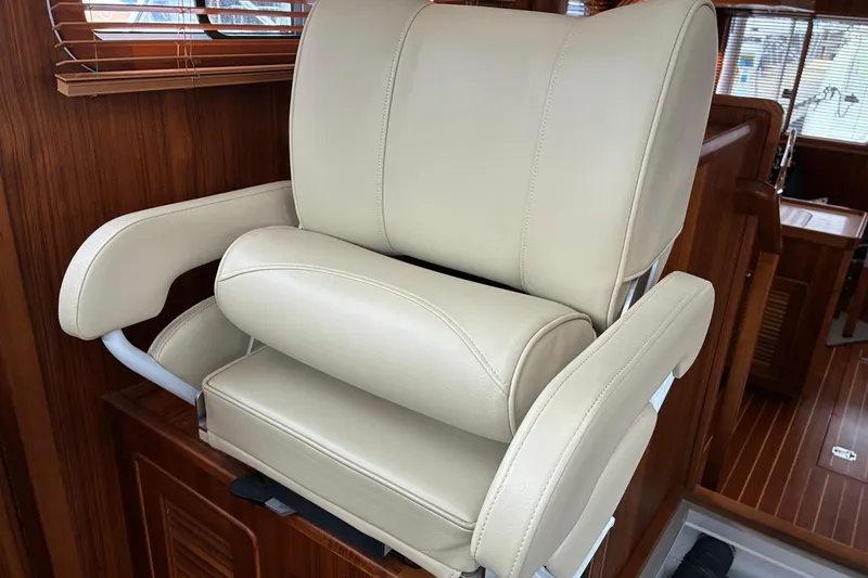 Slide: The Image of 2024 Helmsman Trawlers 43E Pilothouse helm seat. - 28