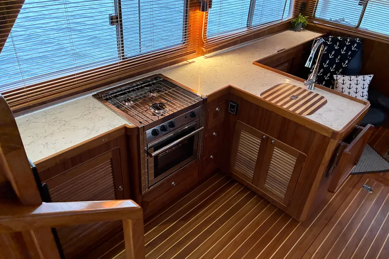 Slide: The Image of Luxurious 2024 Helmsman Trawlers 43E PILOTHOUSE galley viewed from pilothouse looking aft - 29