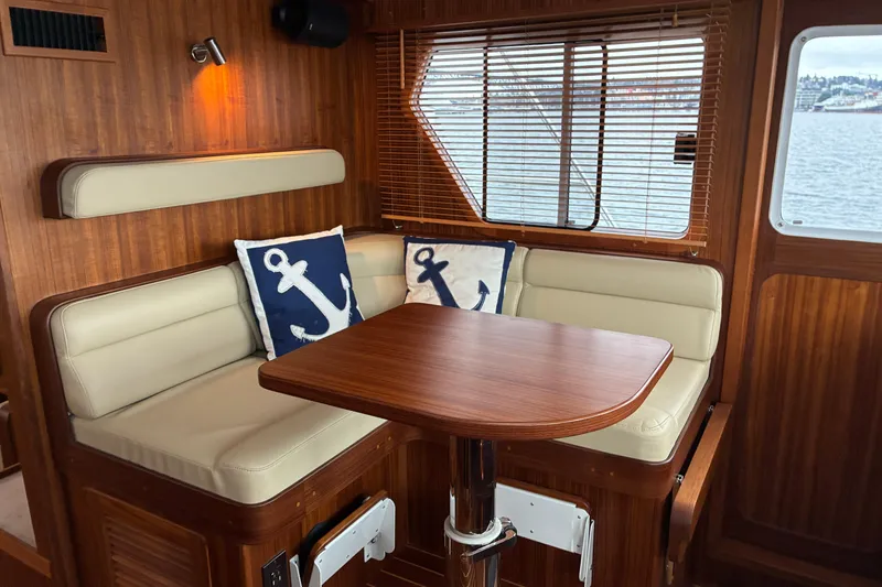 Slide: The Image of Cozy pilothouse settee in 2024 Helmsman Trawlers 43E Pilothouse. - 31