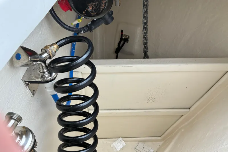 Slide: The Image of 2024 Helmsman Trawlers 43E PILOTHOUSE anchor locker and water wash down hose. - 56