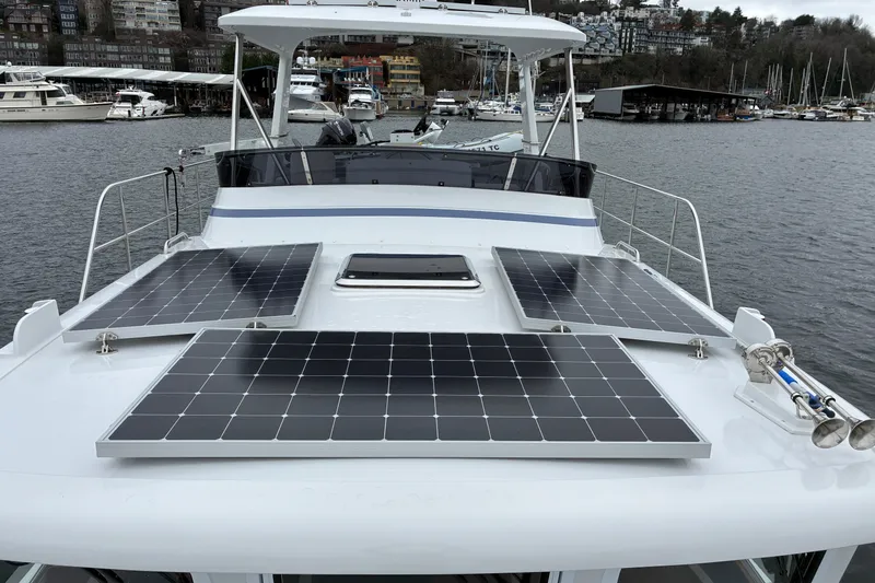 Slide: The Image of 2024 Helmsman Trawlers 43E Pilothouse solar panels mounted on pilothouse. - 58