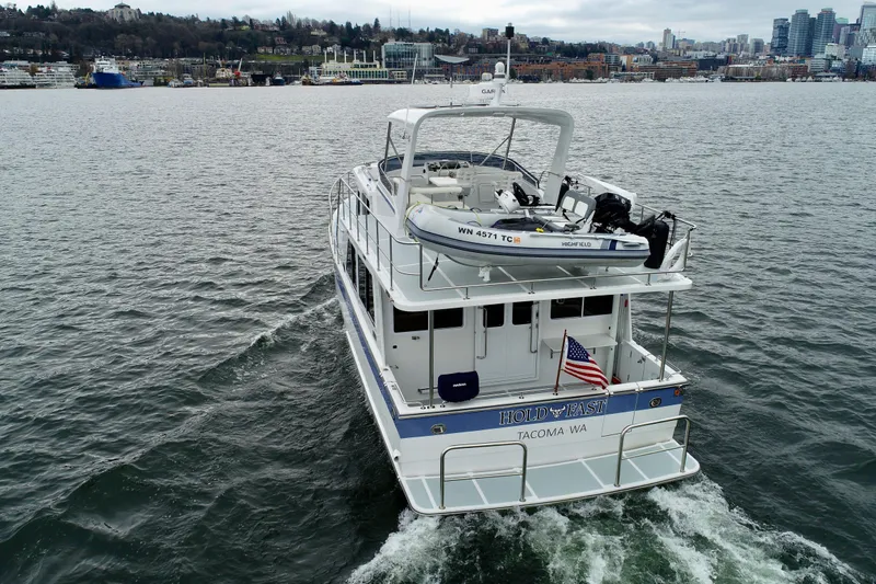 Slide: The Image of 2024 Helmsman Trawlers 43E PILOTHOUSE stern view. - 6