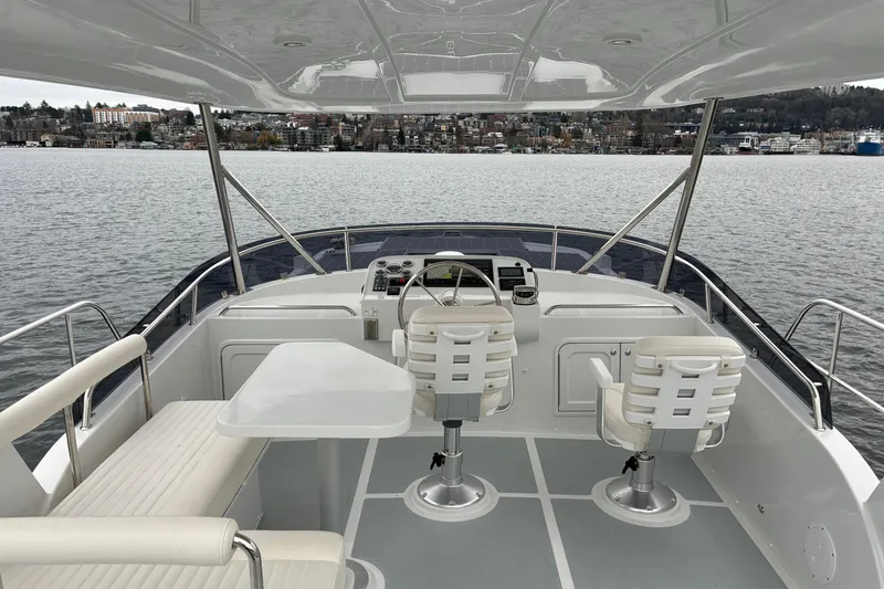 Slide: The Image of 2024 Helmsman Trawlers 43E PILOTHOUSE flybridge helm station and seating. - 63