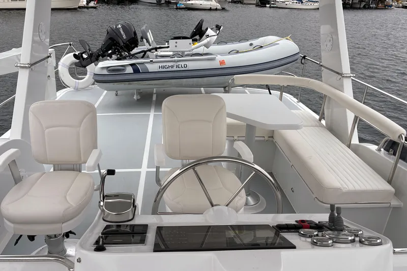 Slide: The Image of 2024 Helmsman Trawlers 43E PILOTHOUSE flybridge looking aft to dinghy storage - 67