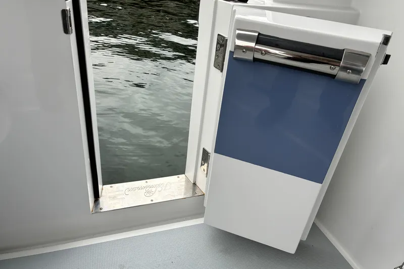 Slide: The Image of Helmsman Trawlers 43E PILOTHOUSE 2024 port side cockpit entry (open). - 75