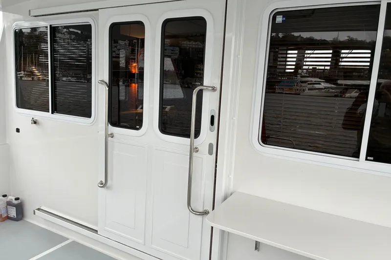 Slide: The Image of Helmsman Trawlers 43E Pilothouse 2024 cockpit salon companionway. - 76