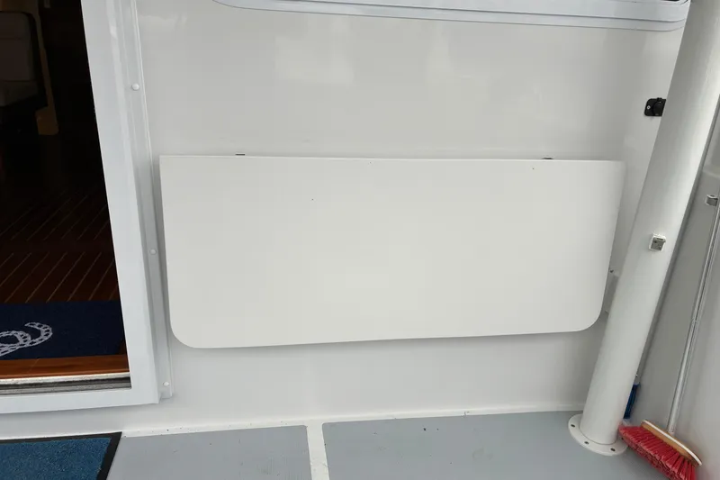 Slide: The Image of 2024 Helmsman Trawlers 43E PILOTHOUSE, fold up / fold down cockpit table. - 79