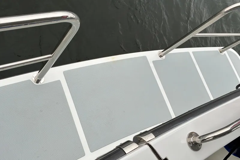 Slide: The Image of 2024 Helmsman Trawlers 43E Pilothouse swim deck with removable safety (staples) rails. - 81