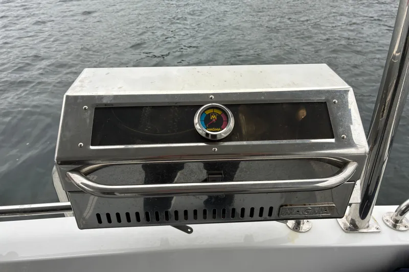 Slide: The Image of Stainless steel Magma grill on 2024 Helmsman Trawlers 43E PILOTHOUSE cockpit rail. - 82
