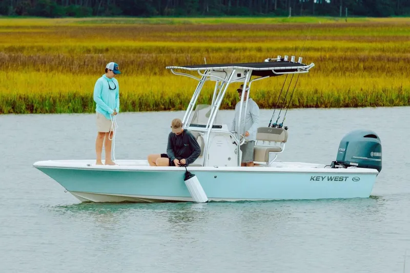 The Image of 2026 Key West 210 Bay Reef boat on trailer in outdoor dealership lot. - 0
