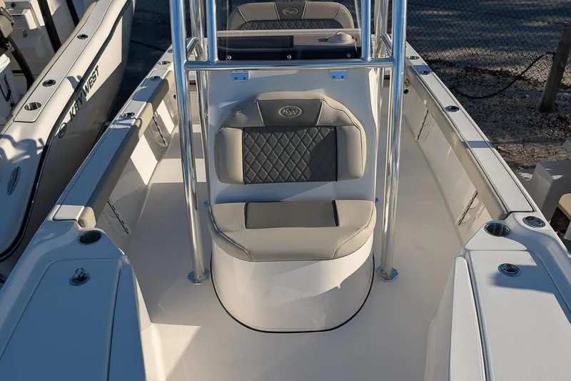 Slide: The Image of 2026 Key West 210 Bay Reef boat interior with cushioned seating and sleek design. - 15