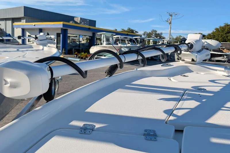 Slide: The Image of 2026 Key West 210 Bay Reef boat with mounted equipment, displayed at a dealership. - 19