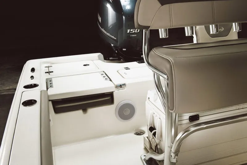 Slide: The Image of 2026 Key West 210 Bay Reef boat with outboard motor in a marina setting. - 3