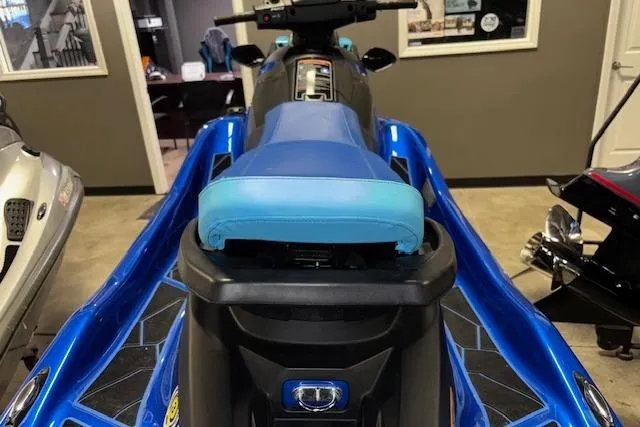 Slide: The Image of 2023 Yamaha WaveRunner EX Limited in showroom, featuring blue seat and sleek design. - 14