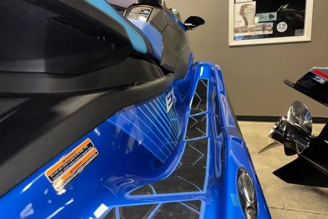 Slide: The Image of 2023 Yamaha WaveRunner EX Limited in showroom, showcasing sleek blue design and features. - 15