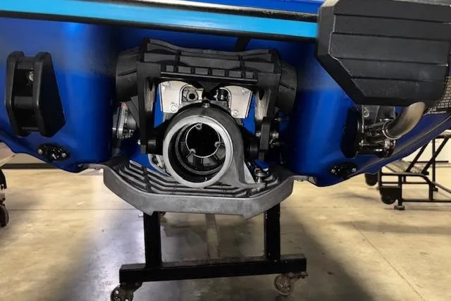 Slide: The Image of 2023 Yamaha WaveRunner EX Limited jet propulsion system, close-up view in a garage setting. - 17