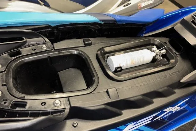 Slide: The Image of 2023 Yamaha WaveRunner EX Limited storage compartment with fire extinguisher. - 20