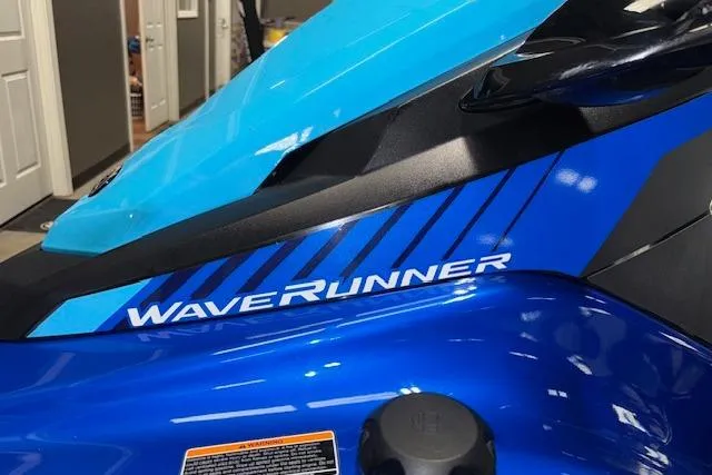 Slide: The Image of 2023 Yamaha WaveRunner EX Limited, blue and black design, close-up view. - 26